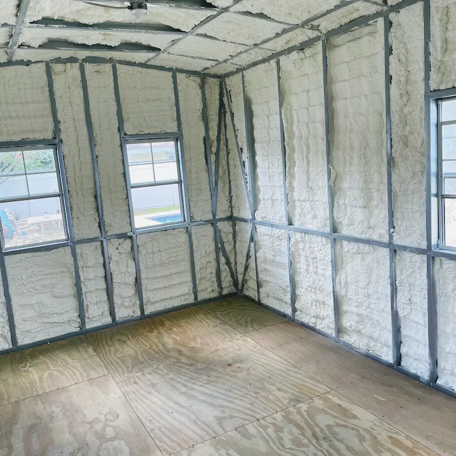 Closed-cell spray foam insulation applied to wall cavities in a residential project in Robbinsville